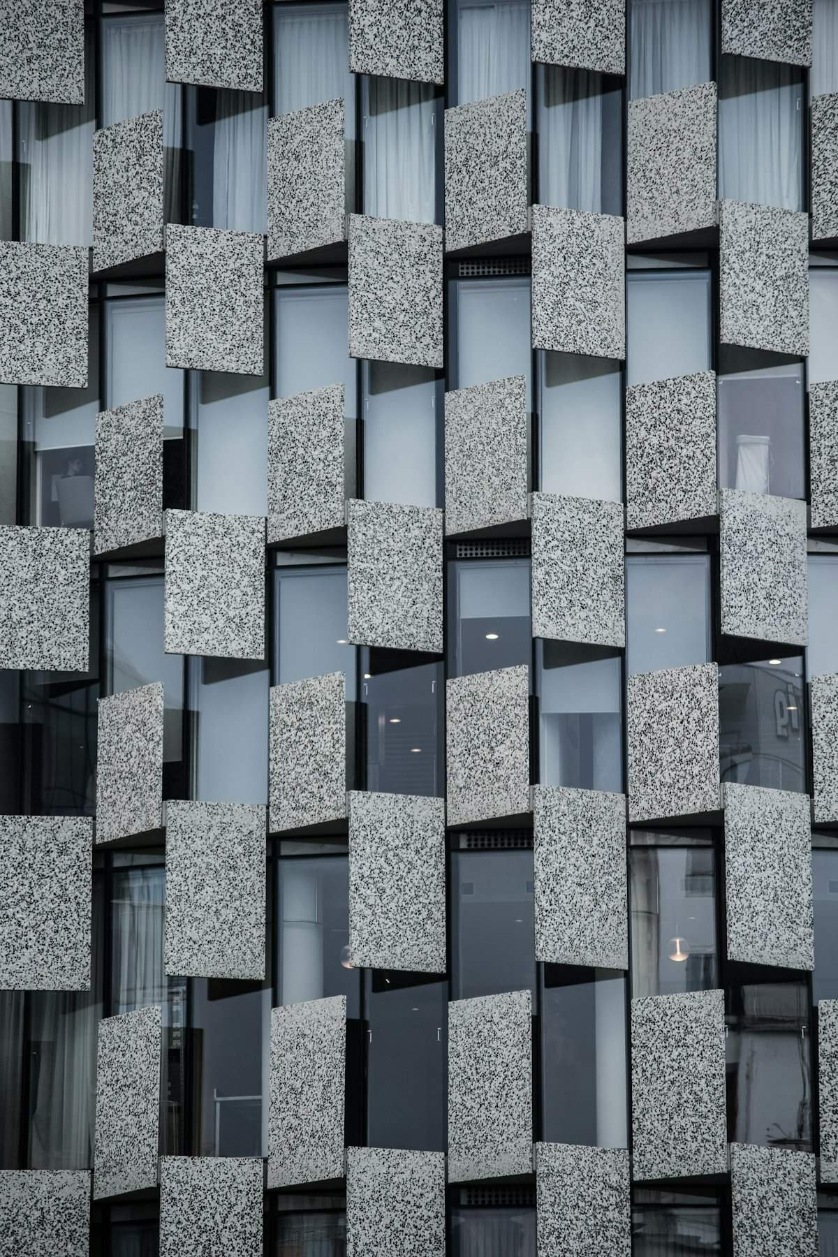 Building facade clad in grey granite panels