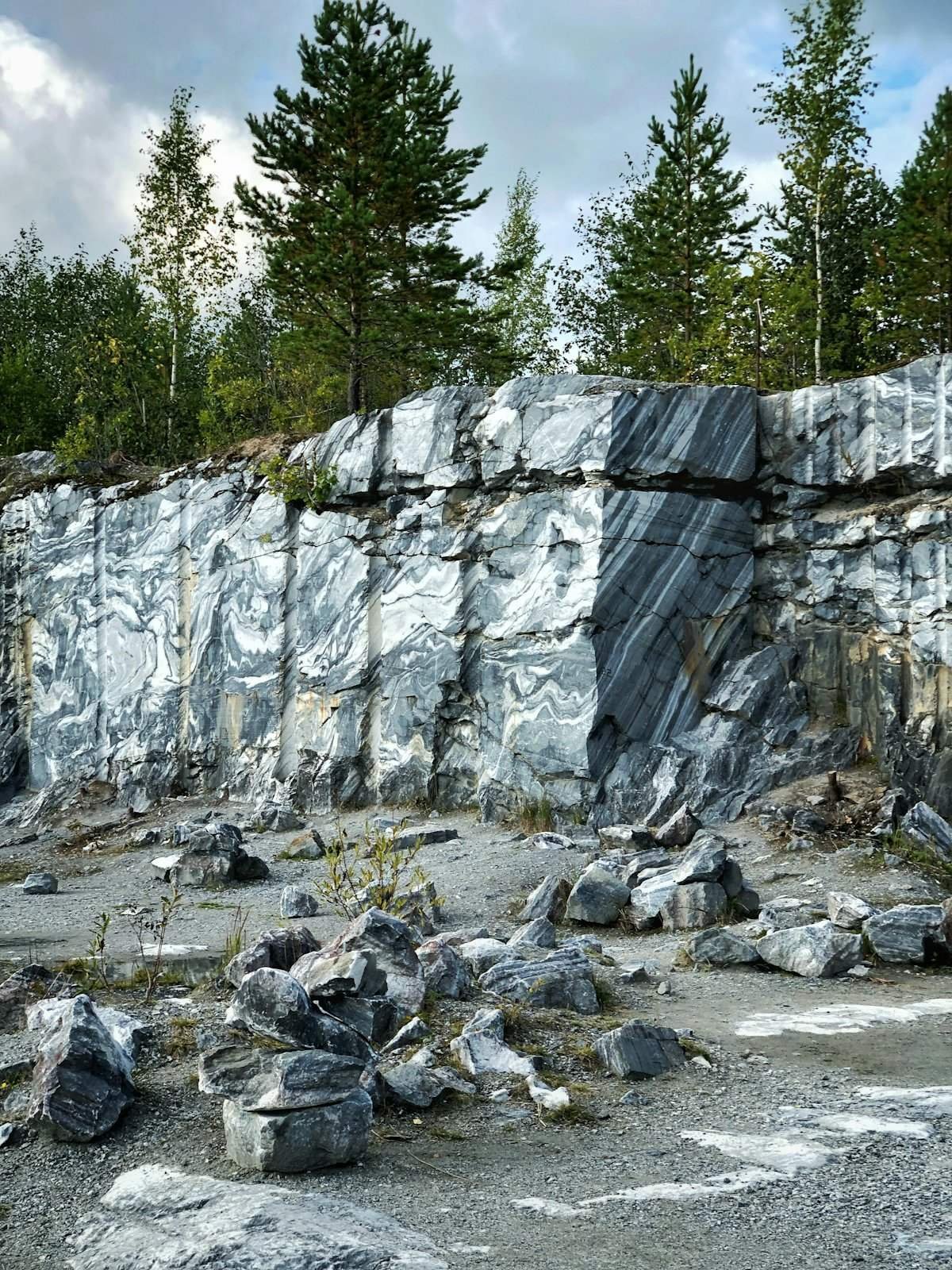 Cut granite blocks at the foot of a quarry wall
