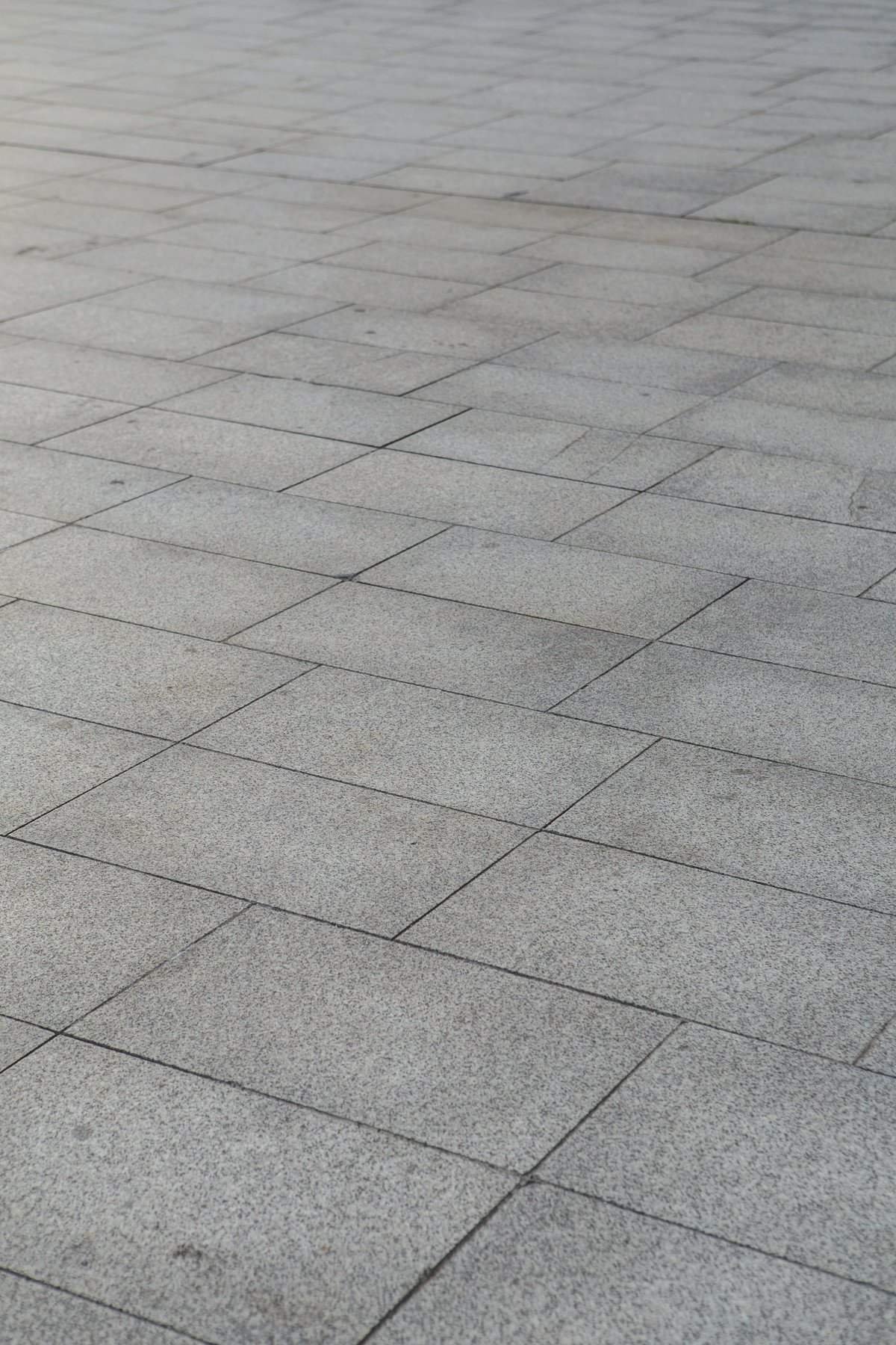 Grey granite floor tiles laid in a grid